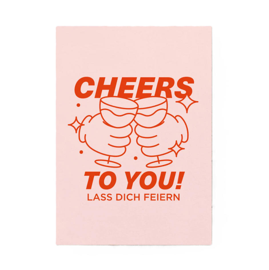 Postkarte DIN A6 mit Schriftzug „Cheers to you“ in roter Typografie auf rosafarbenem Karton, Design von Studio Ciao